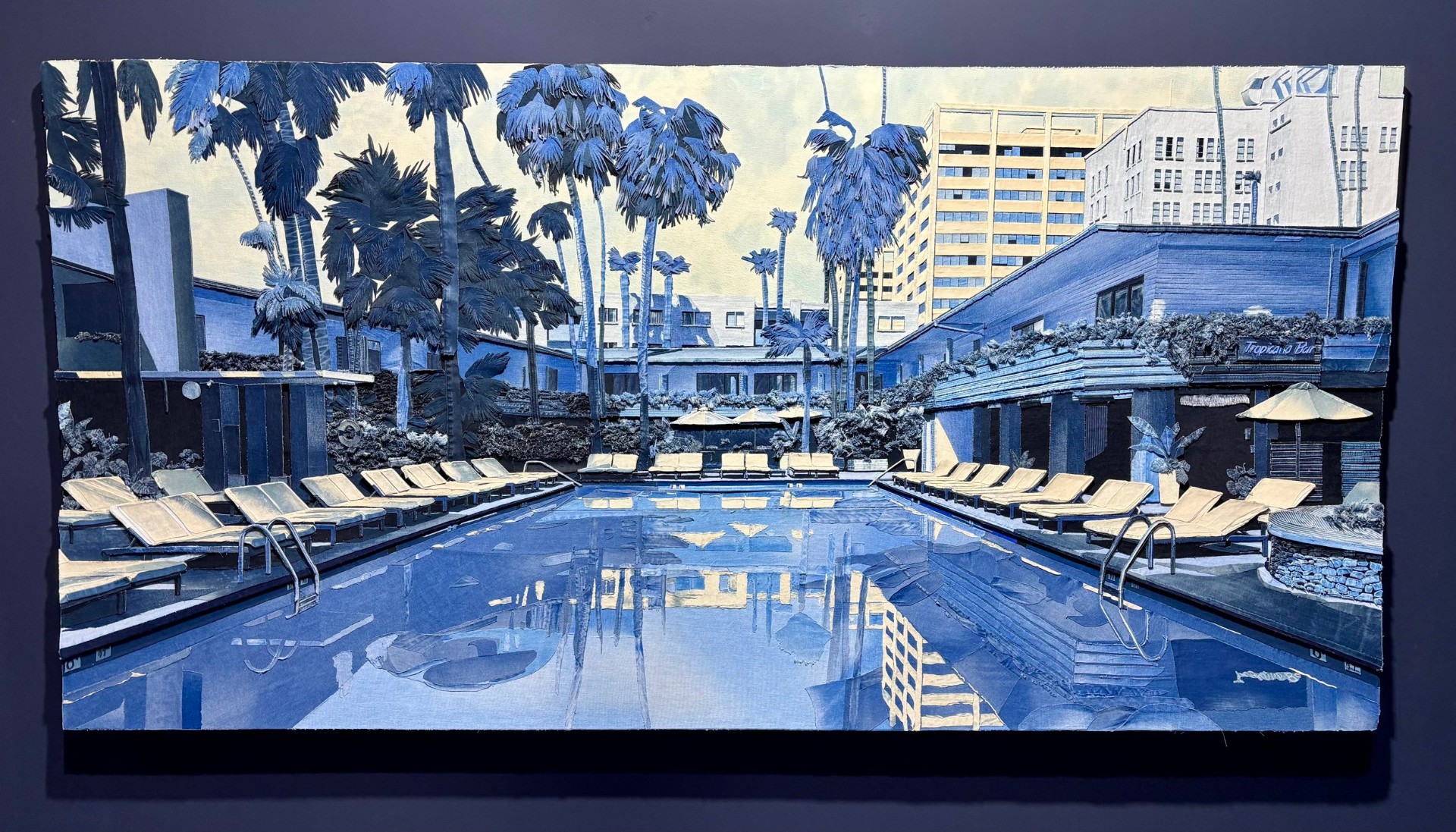 Colorful painting of a hotel pool area with palm trees, lounge chairs, umbrellas, and surrounding buildings, all in shades of blue and beige.