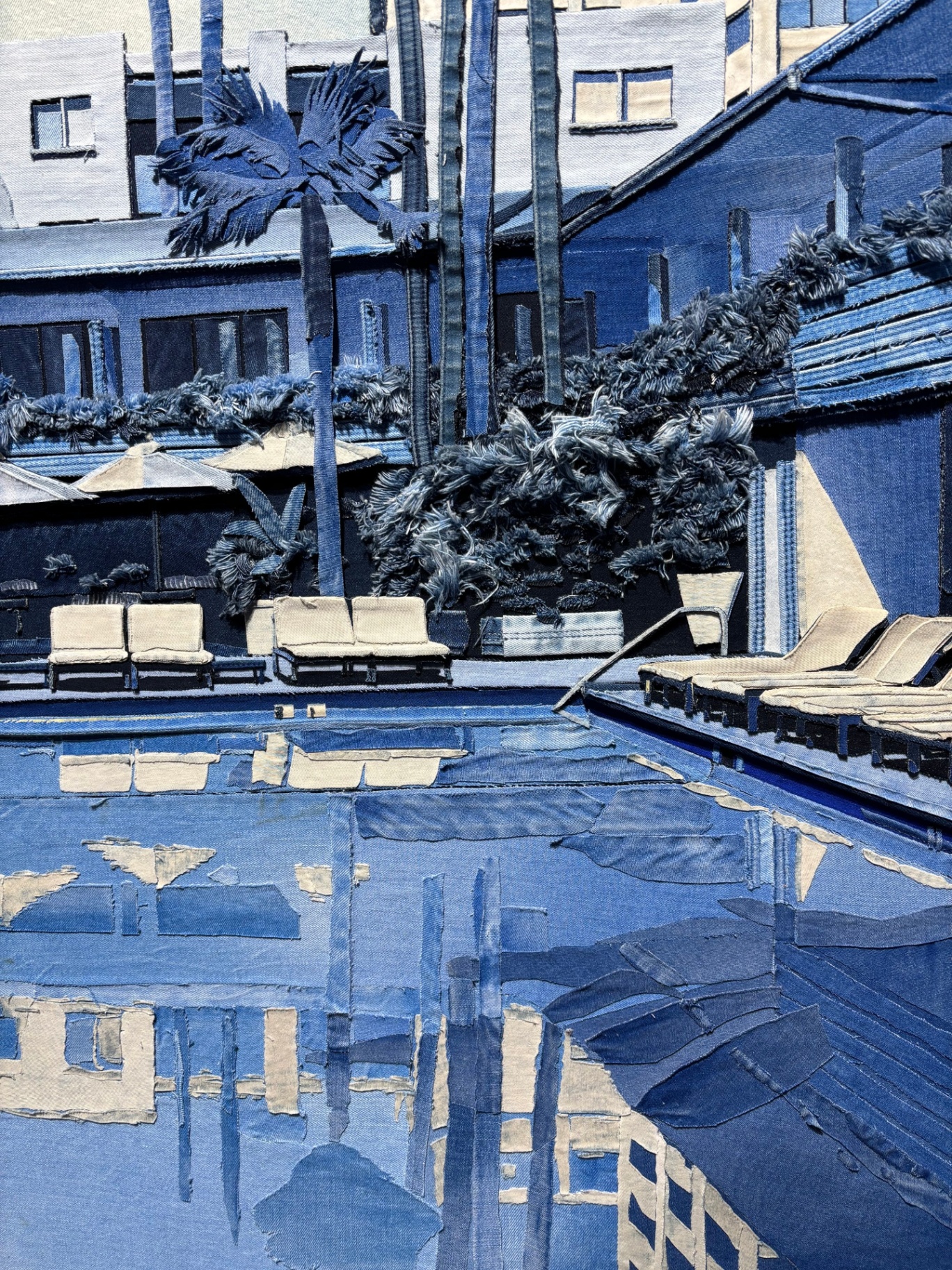 Painting of a modern hotel poolside scene with lounge chairs, umbrellas, palm trees, and a reflective pool in shades of blue and beige.